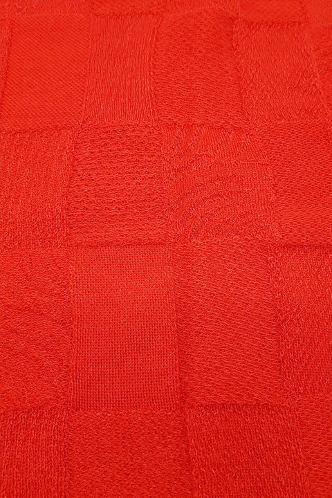 Close up of the pattern of the Chilli Royal Alpaca and Merino Textured Wrap