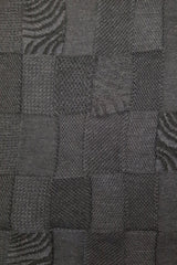 Closeup of the pattern of the Dark Grey Charcoal Royal Alpaca and Merino Textured Wrap