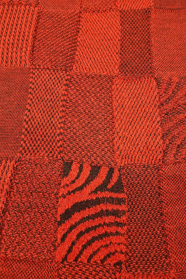 Close up of the pattern of the Red Black Royal Alpaca and Merino Textured Wrap