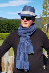 Roy wearing the Denim Black Royal Alpaca and Merino Textured Wrap